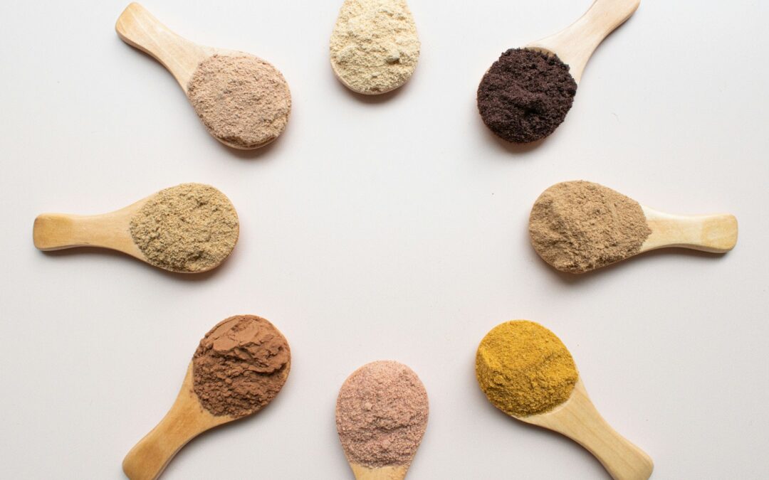 six different types of powdered spoons arranged in a circle